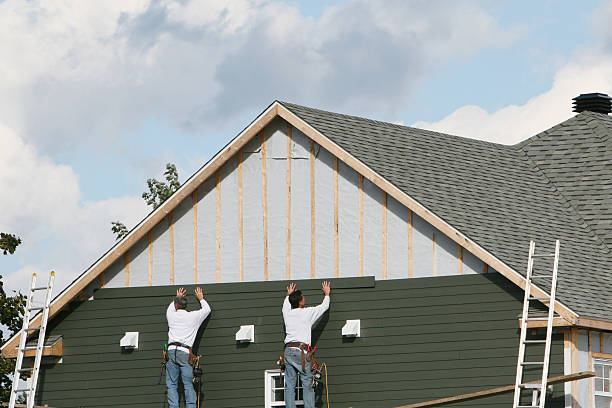 Professional Storm Damage Siding Repair technician working in Eastover, NC